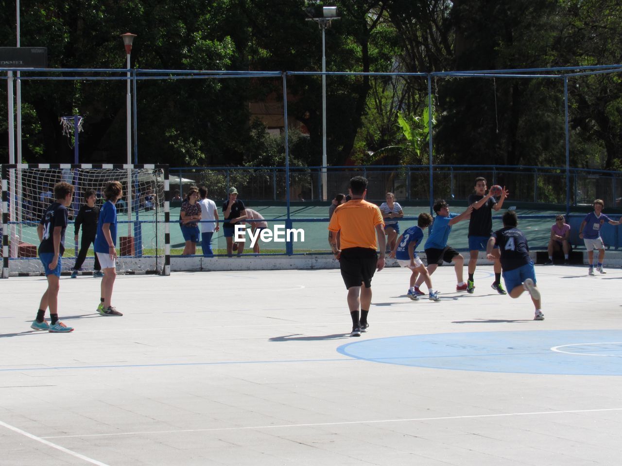 GROUP OF PEOPLE PLAYING ON FIELD