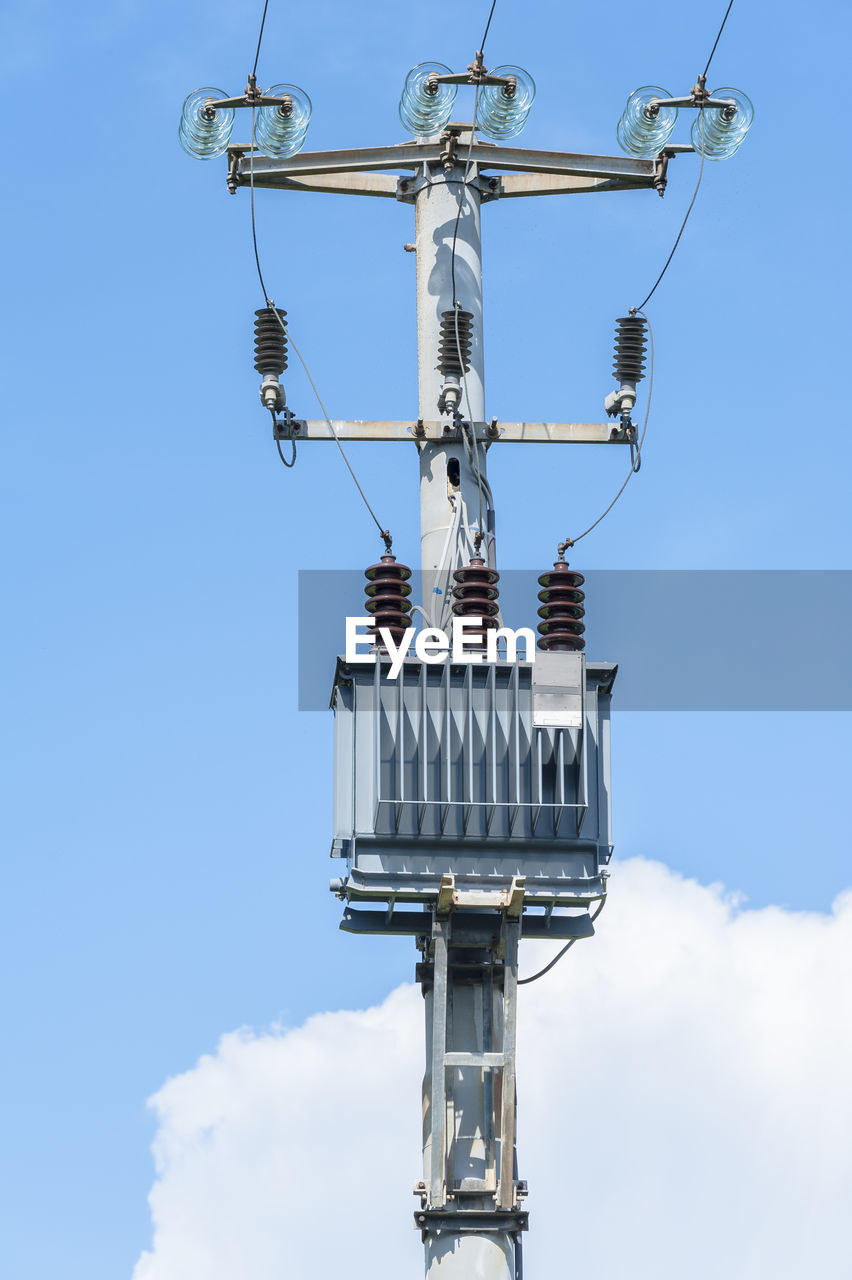 LOW ANGLE VIEW OF TELEPHONE POLE AGAINST SKY