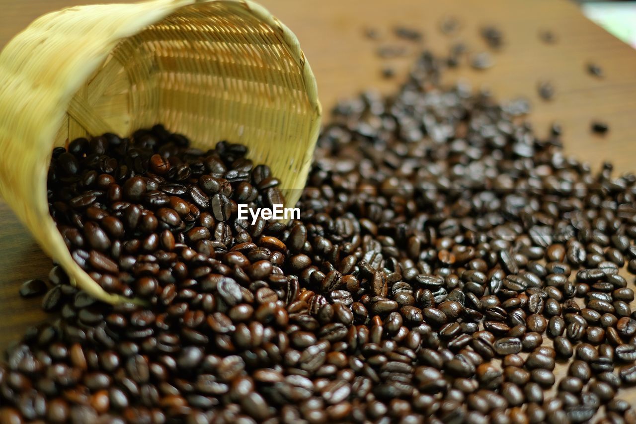 Close-up of roasted coffee beans on table