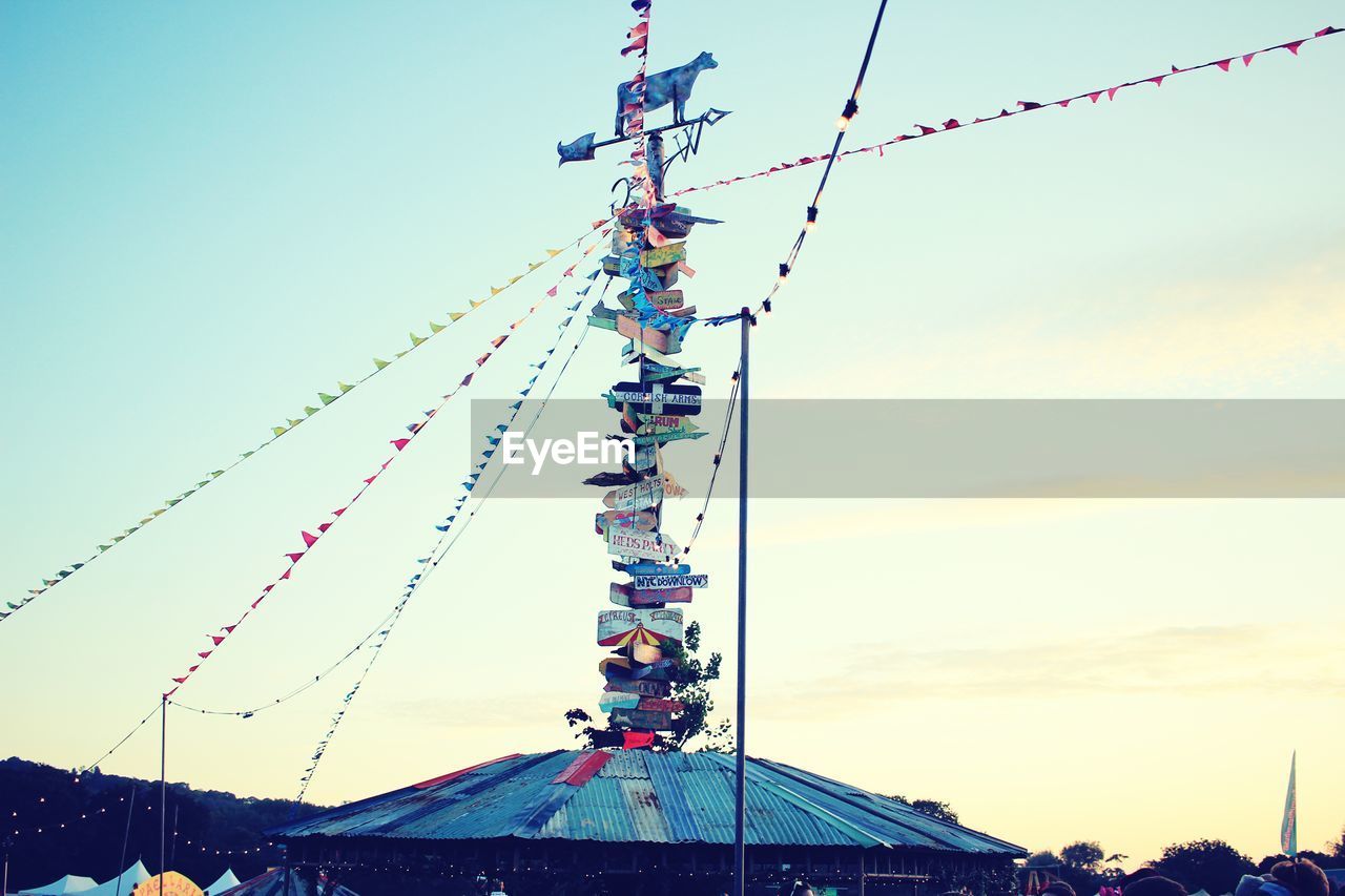 LOW ANGLE VIEW OF FERRIS WHEEL AGAINST SKY