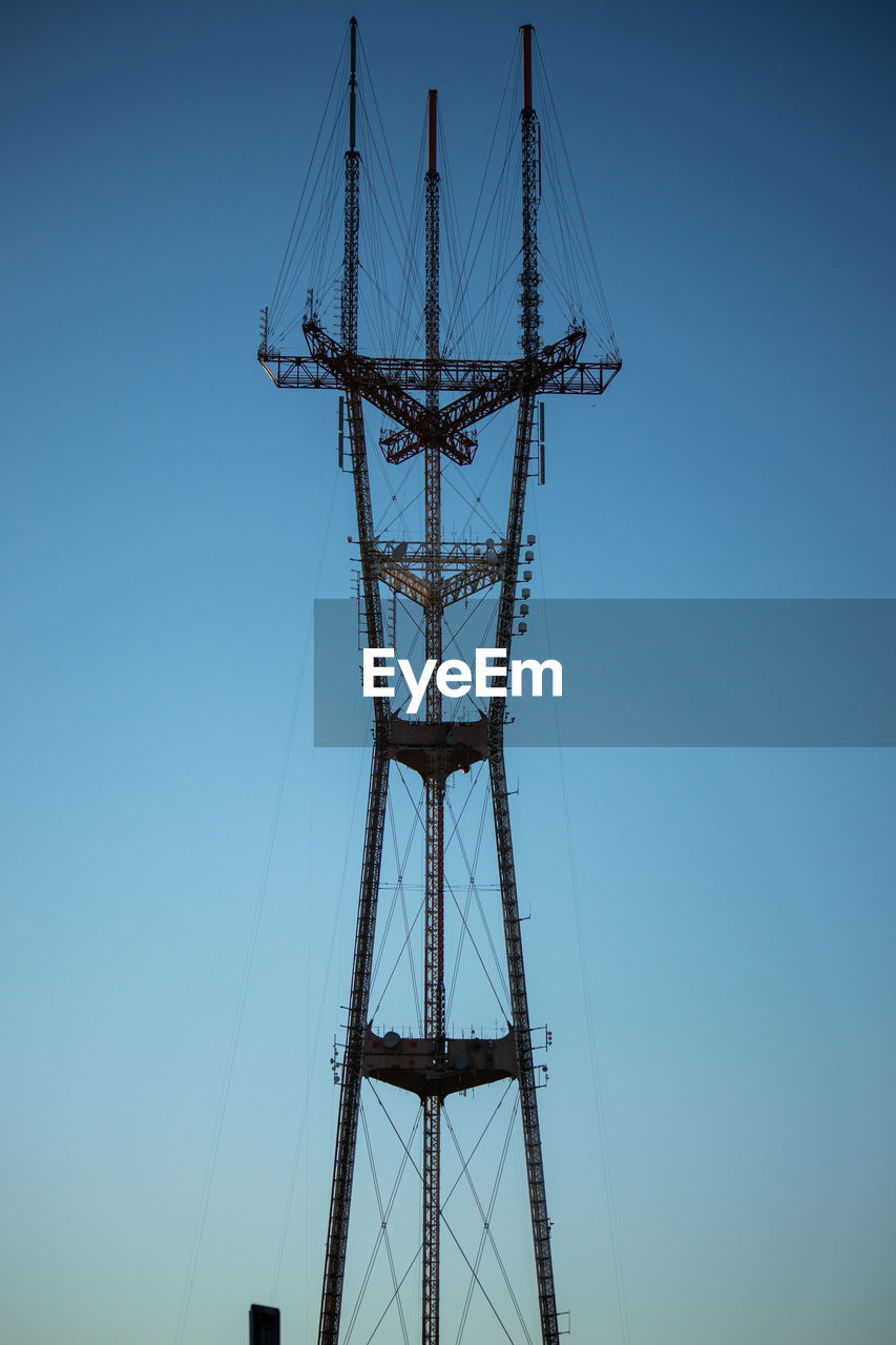 transmission tower, sky, tower, overhead power line, technology, electricity, architecture, clear sky, built structure, power generation, nature, electricity pylon, no people, blue, mast, line, electrical supply, power supply, cable, outdoors, low angle view, communication, metal, industry, silhouette, day, global communications