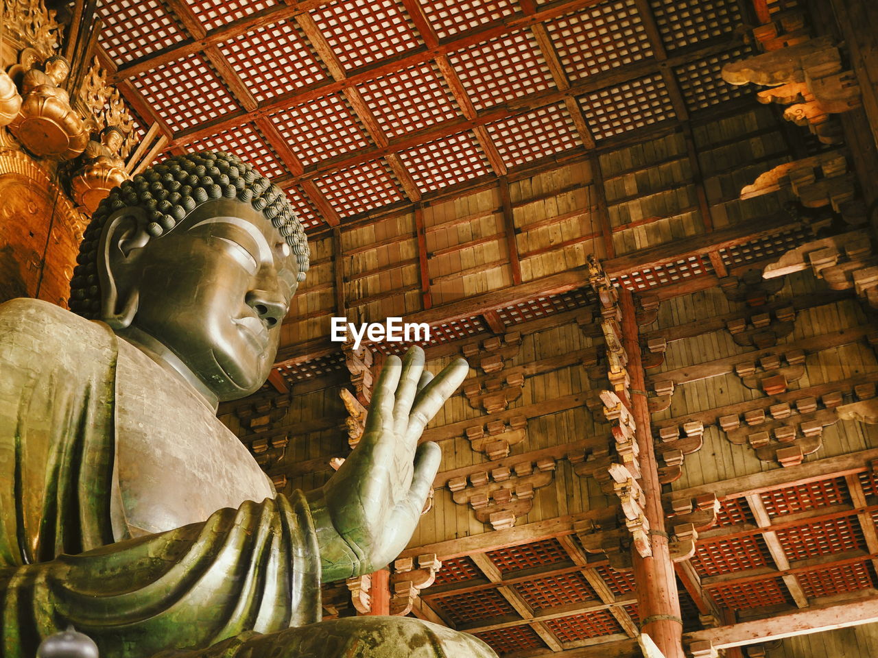 LOW ANGLE VIEW OF STATUE OF BUDDHA