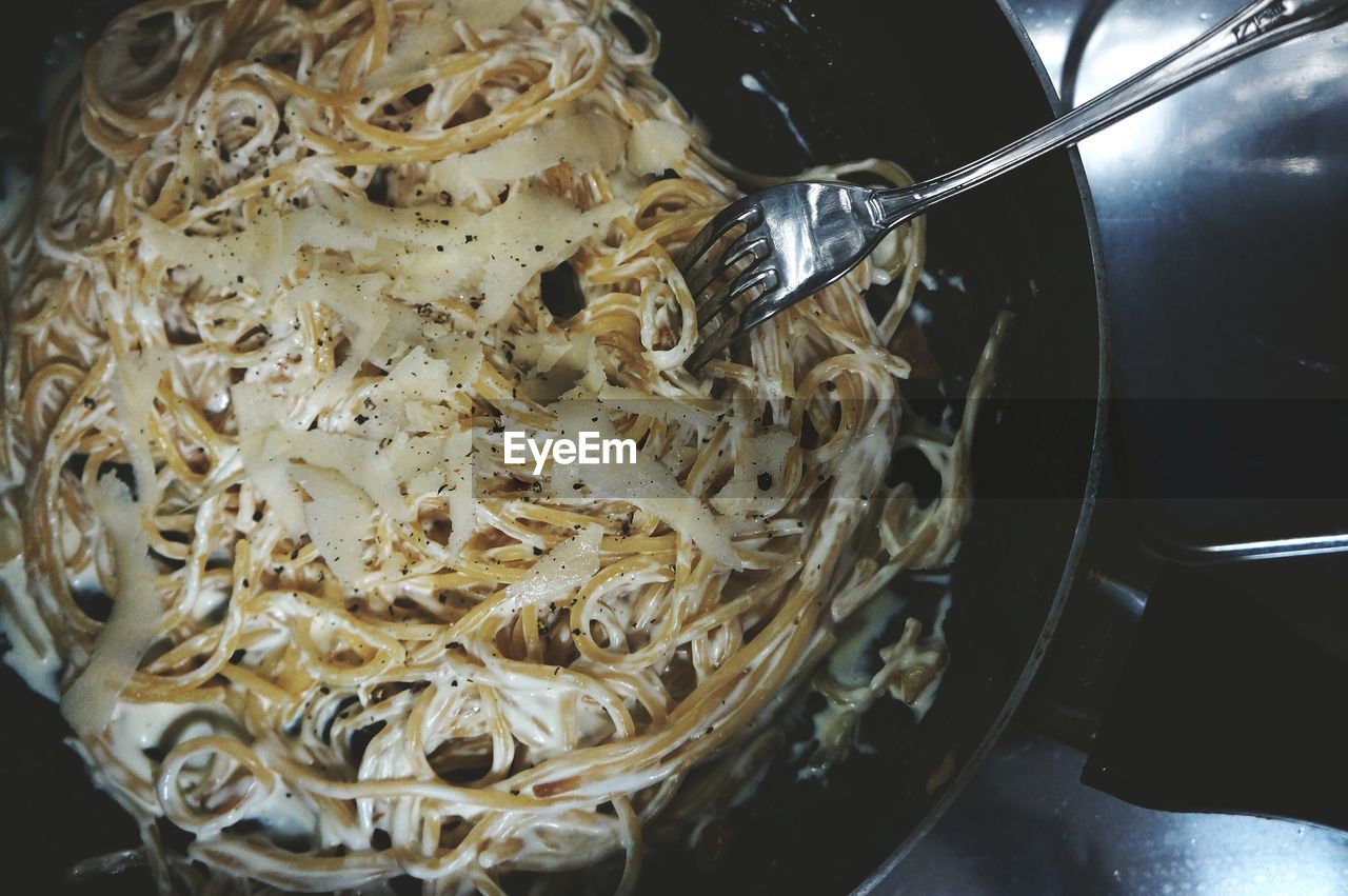 Close-up of pasta with cheese in cooking pan