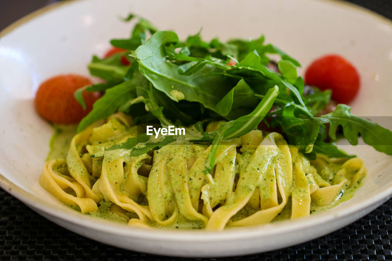 CLOSE-UP OF SALAD SERVED IN PLATE WITH SAUCE