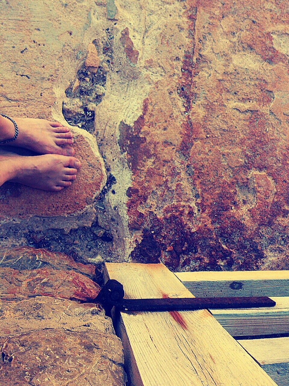 Low section of woman with bare feet standing on steps