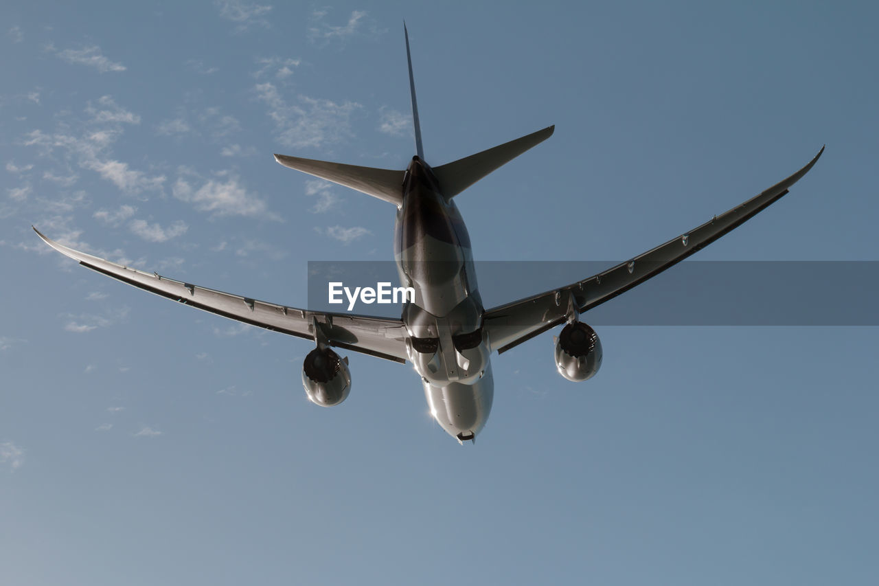 LOW ANGLE VIEW OF AIRSHOW AGAINST SKY