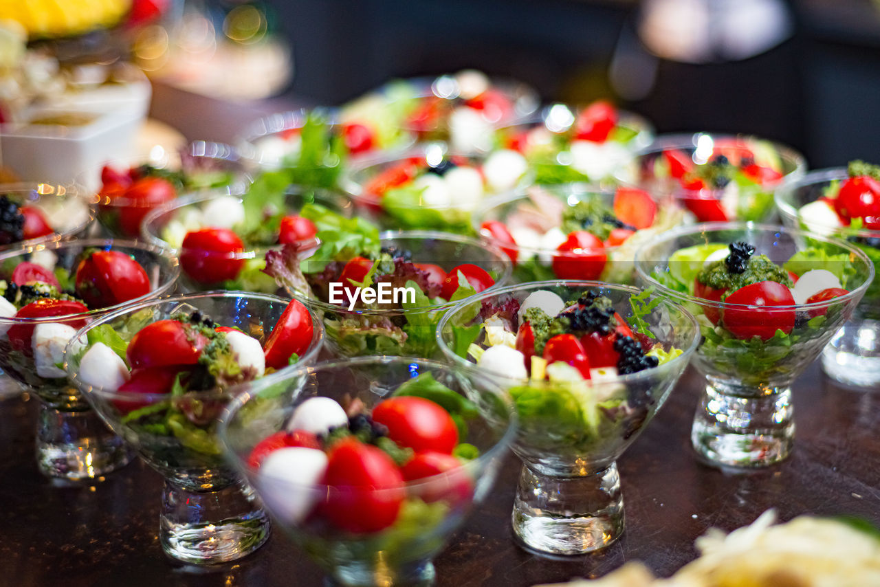 food and drink, food, fruit, healthy eating, meal, freshness, vegetable, no people, wellbeing, appetizer, dish, tomato, table, selective focus, glass, brunch, plant, red, salad, buffet, produce, drinking glass, berry, abundance, strawberry, still life, household equipment
