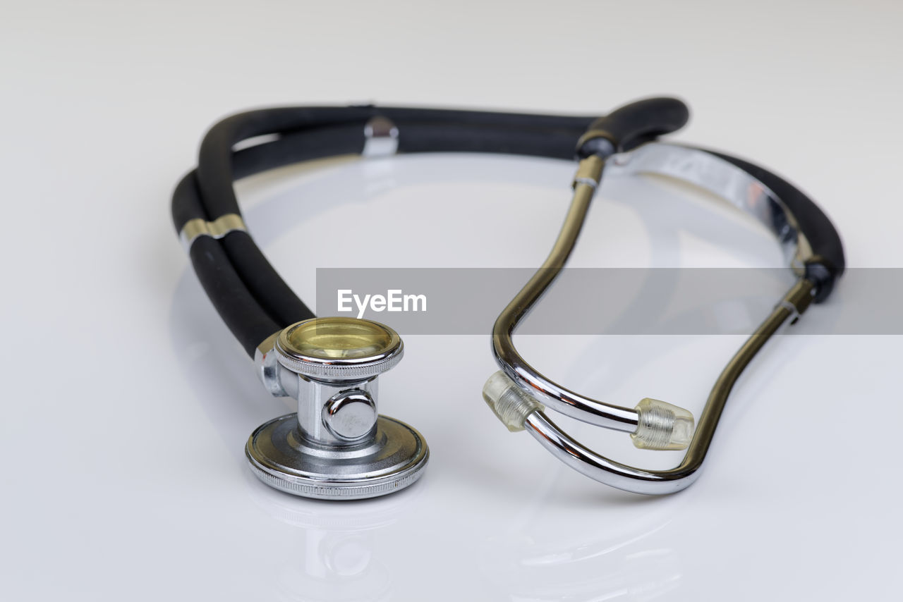 High angle view of stethoscope on white background