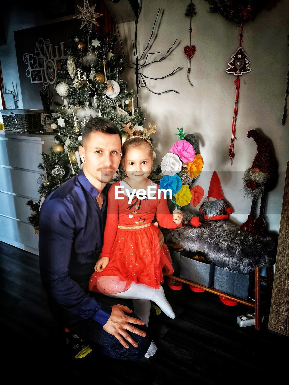 PORTRAIT OF MOTHER WITH CHRISTMAS TREE