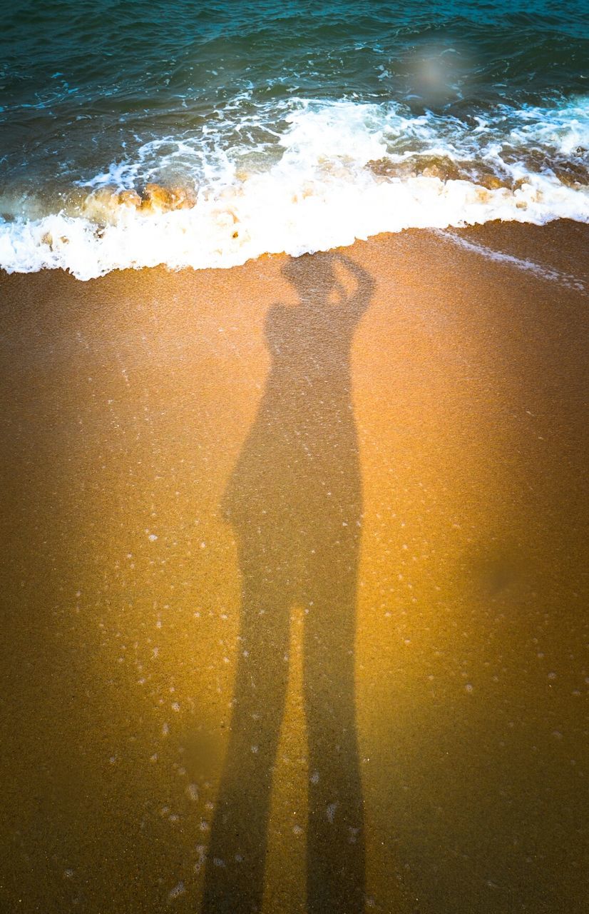 Shadow of a woman on beach
