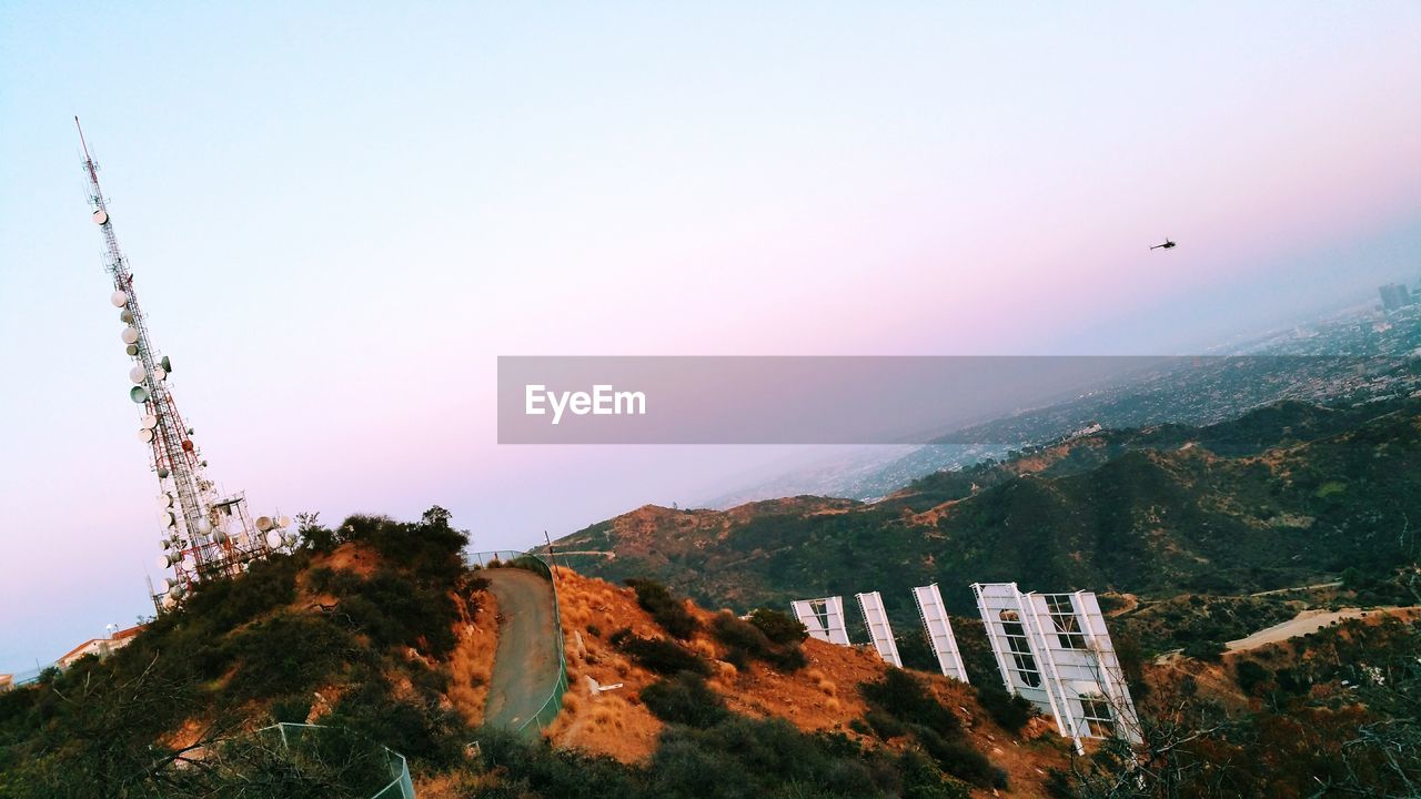 Low angle view of communications tower on mountain