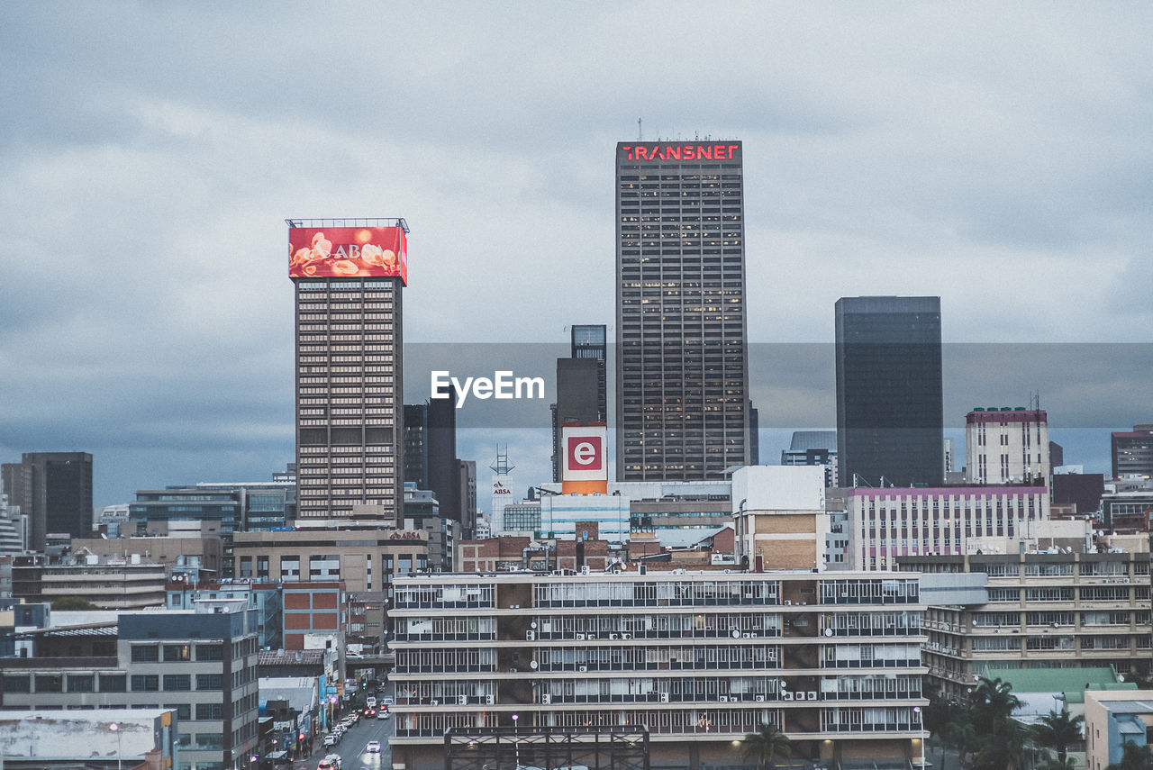 Modern buildings in city against sky