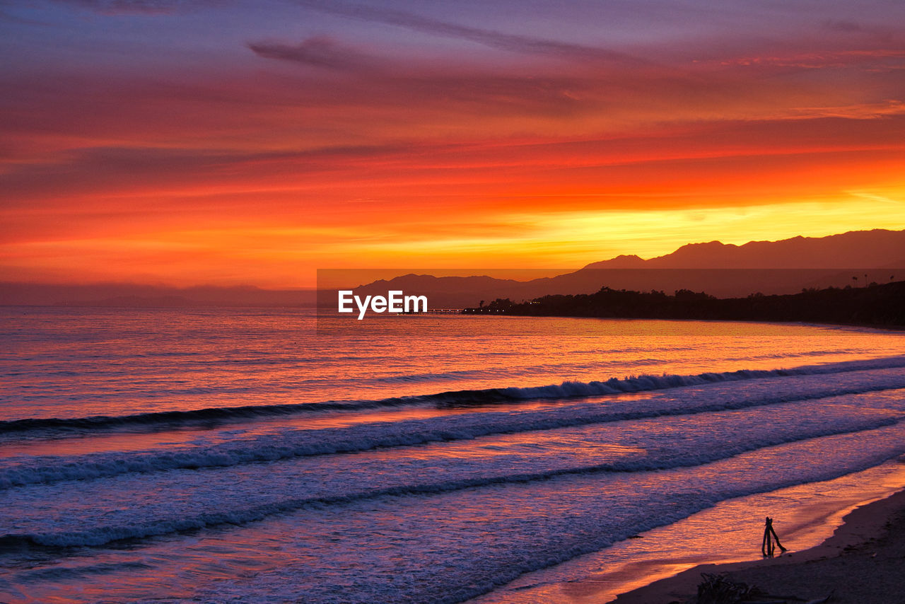 scenic view of sea against orange sky