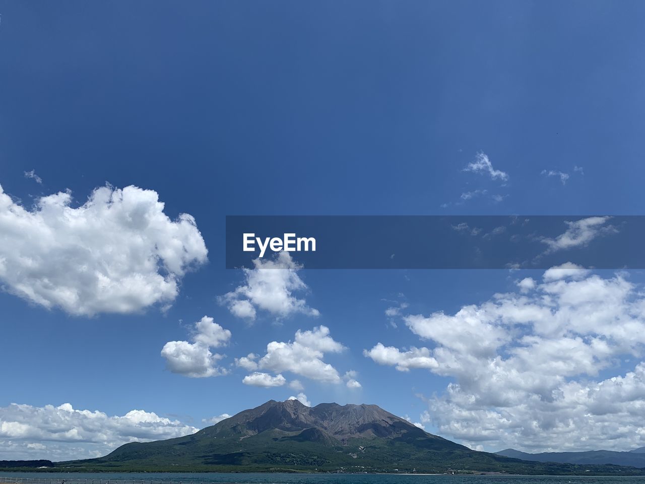 Scenic view of landscape against cloudy sky