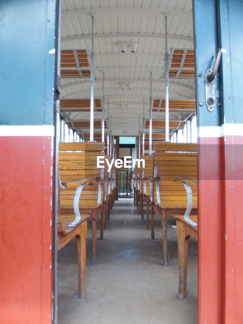 Empty wooden seats in tram