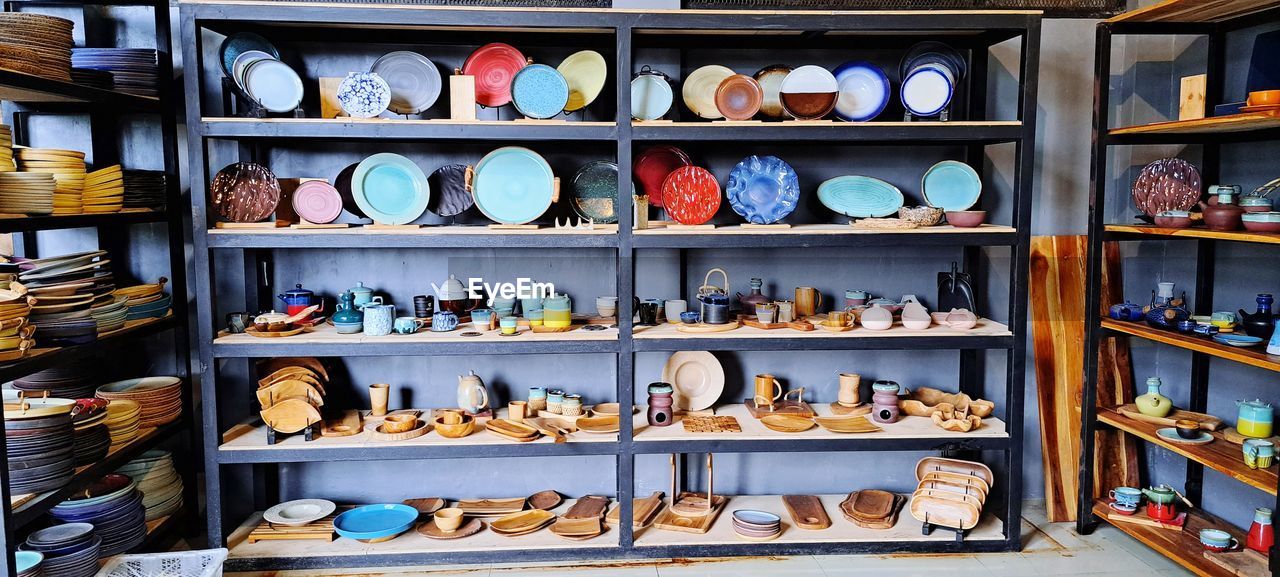 shelf, large group of objects, retail, abundance, variation, no people, store, arrangement, in a row, shoe, order, indoors, for sale, business, grocery store