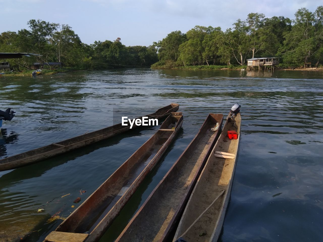 BOATS ON LAKE AGAINST SKY