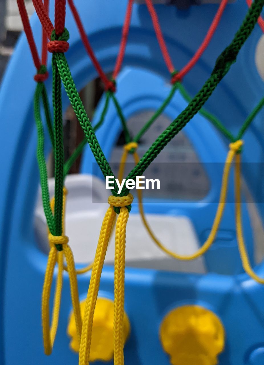 yellow, blue, close-up, green, no people, flower, focus on foreground, cable, macro photography, playground, rope, electricity, metal