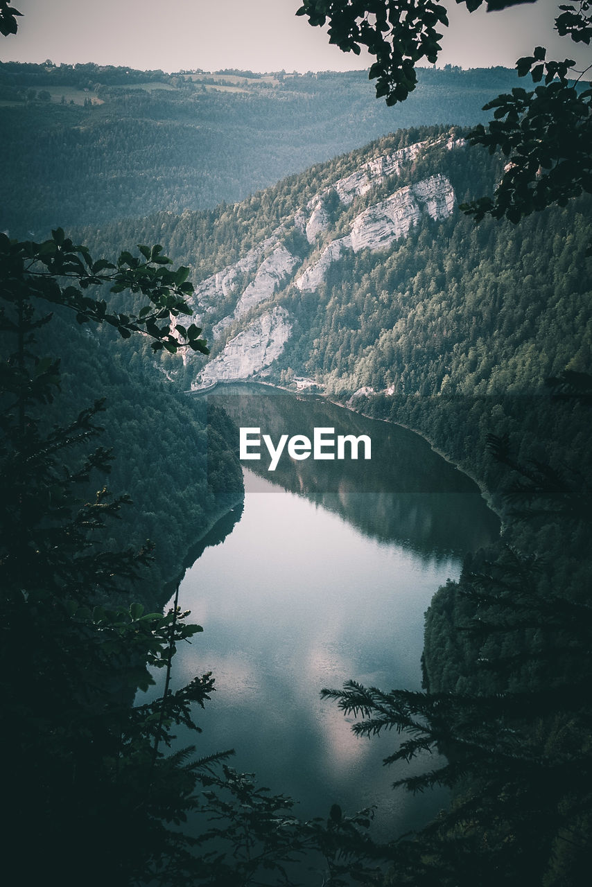 High angle view of trees and mountains against sky