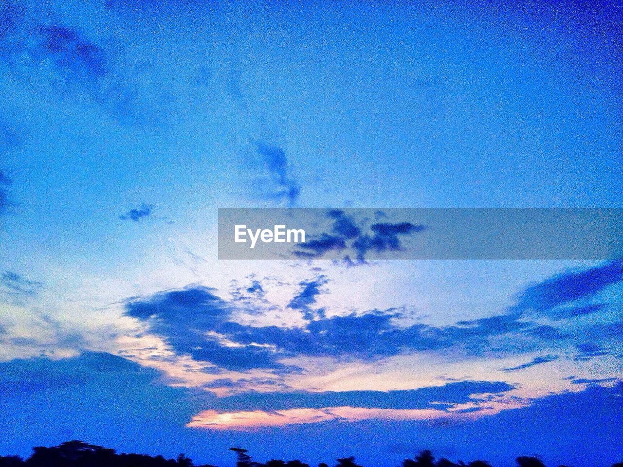 Low angle view of blue sky at sunset