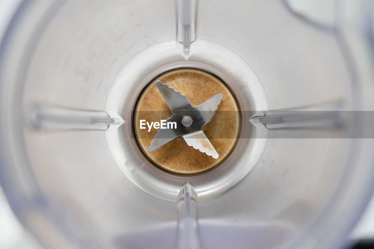 HIGH ANGLE VIEW OF COFFEE CUP IN GLASS