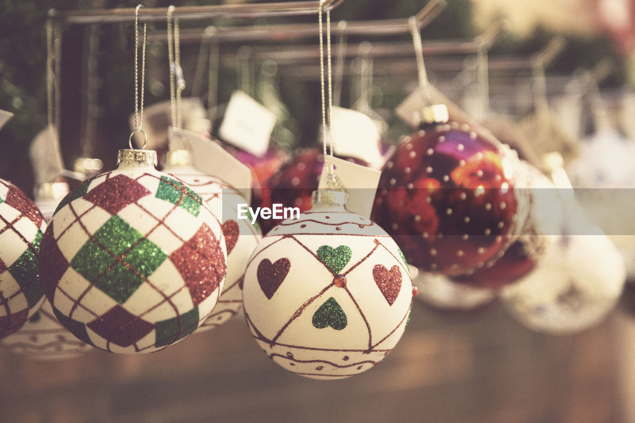 Close-up of christmas ornaments hanging at store