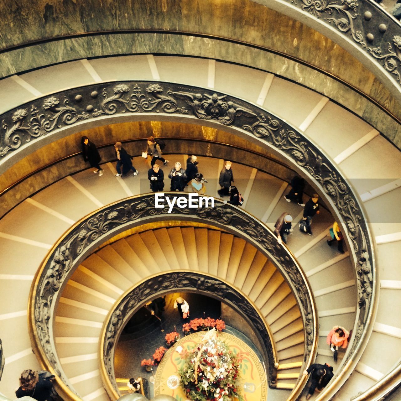 HIGH ANGLE VIEW OF PEOPLE WALKING ON STAIRS