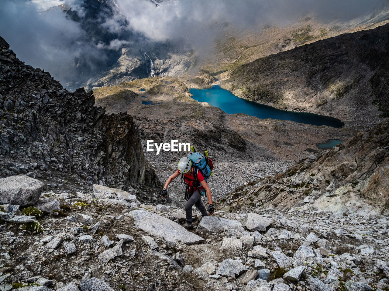 High angle view of woman climbing mountain