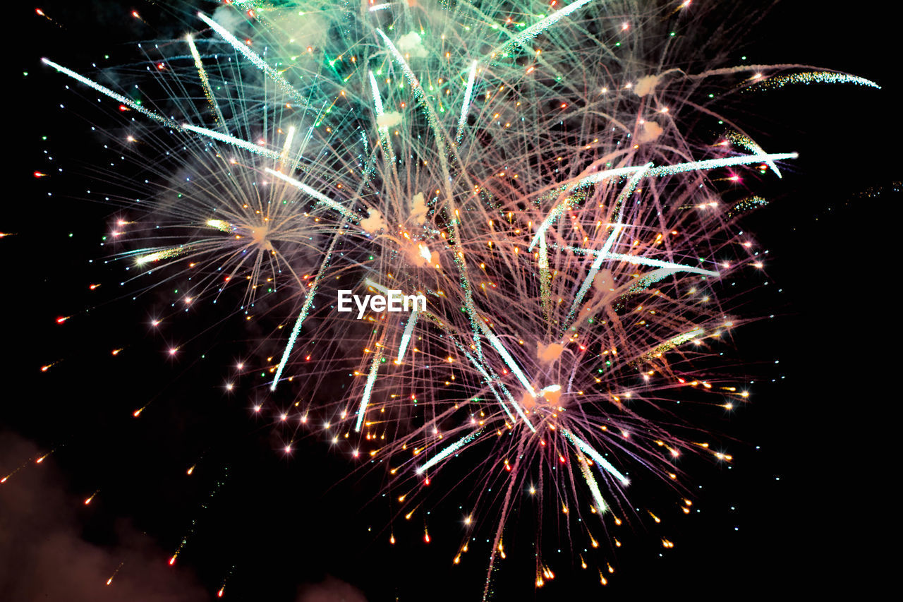 LOW ANGLE VIEW OF FIREWORK DISPLAY