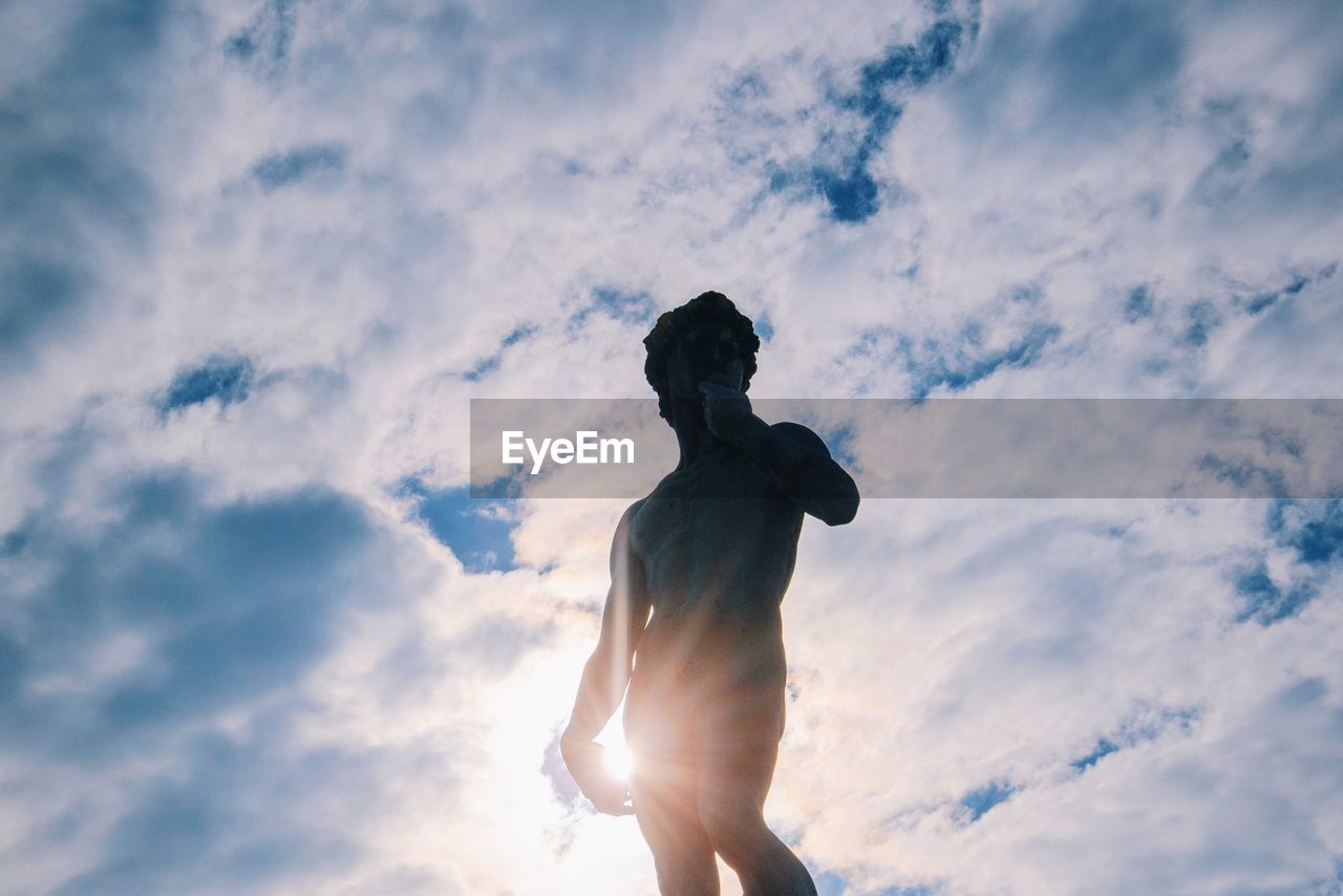 LOW ANGLE VIEW OF SILHOUETTE STATUE