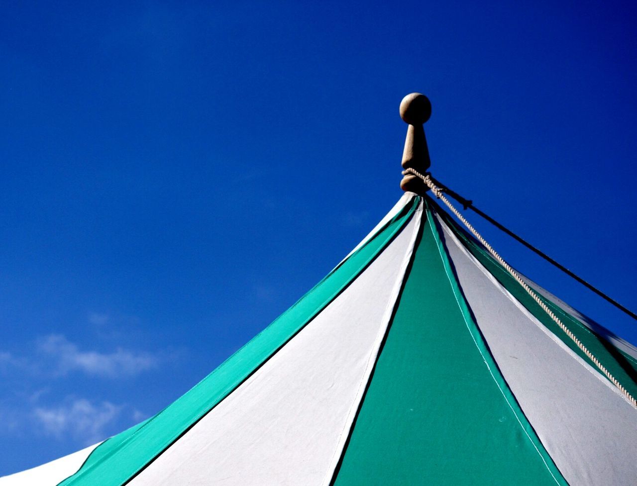 Roof of tent against blue sky