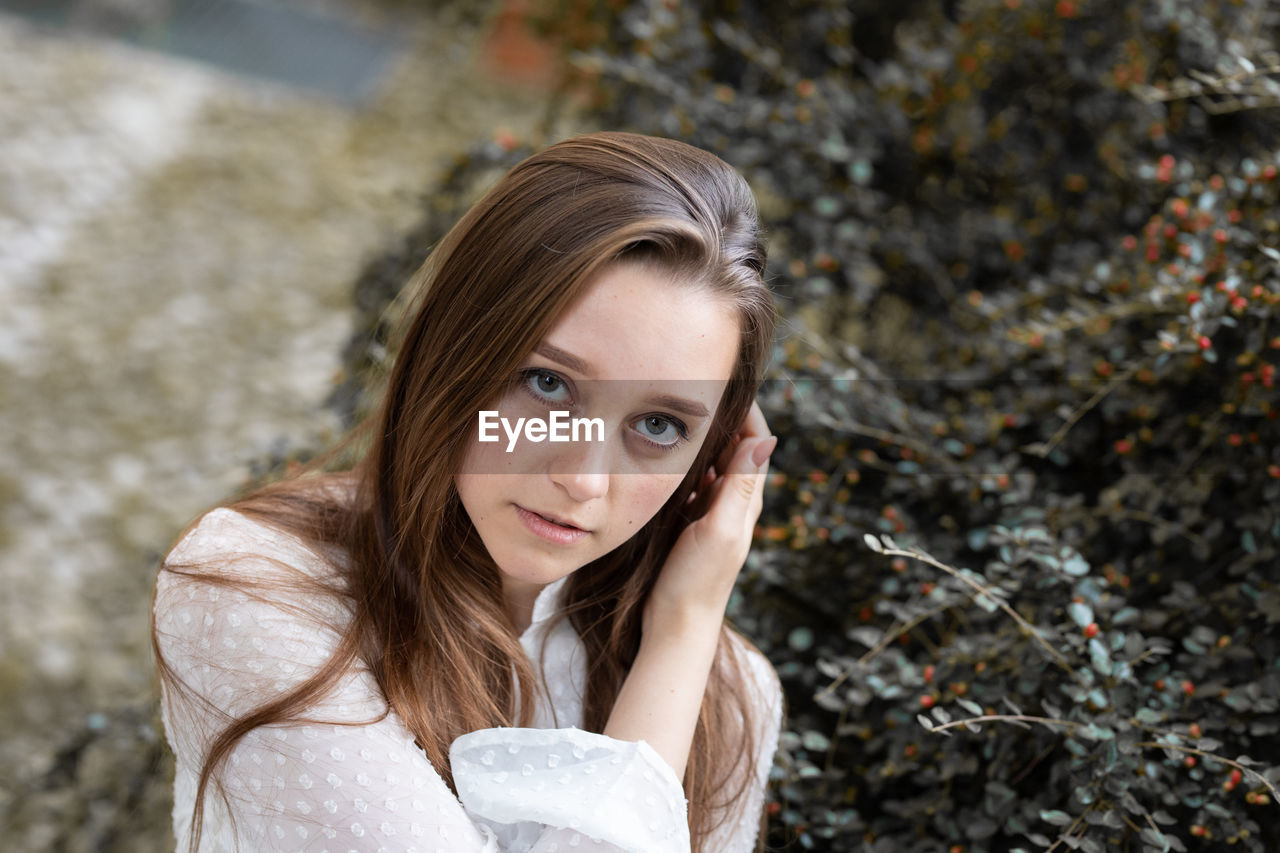 Portrait of a beautiful young woman outdoors