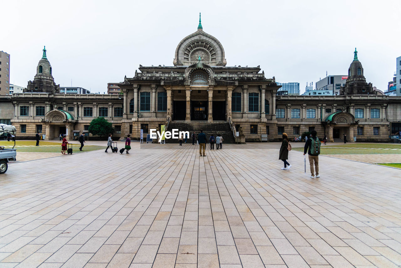 Group of people in front of historical building