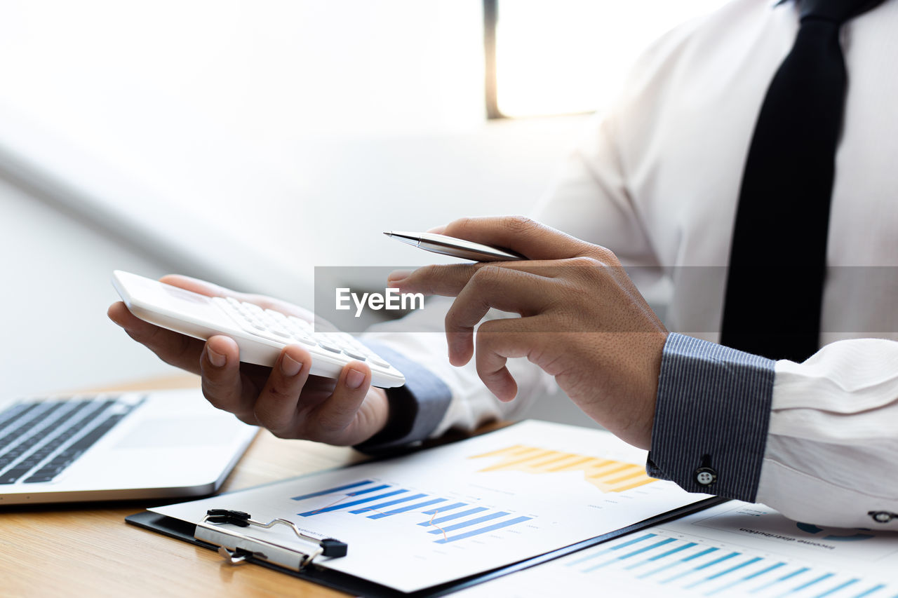 Close-up of businessman working in office