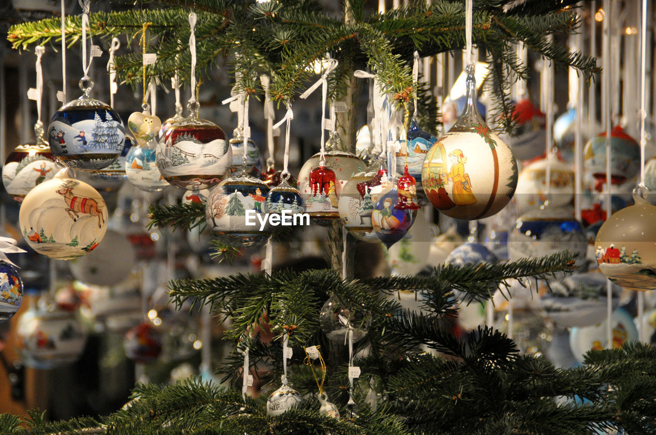 Christmas decorations hanging on tree