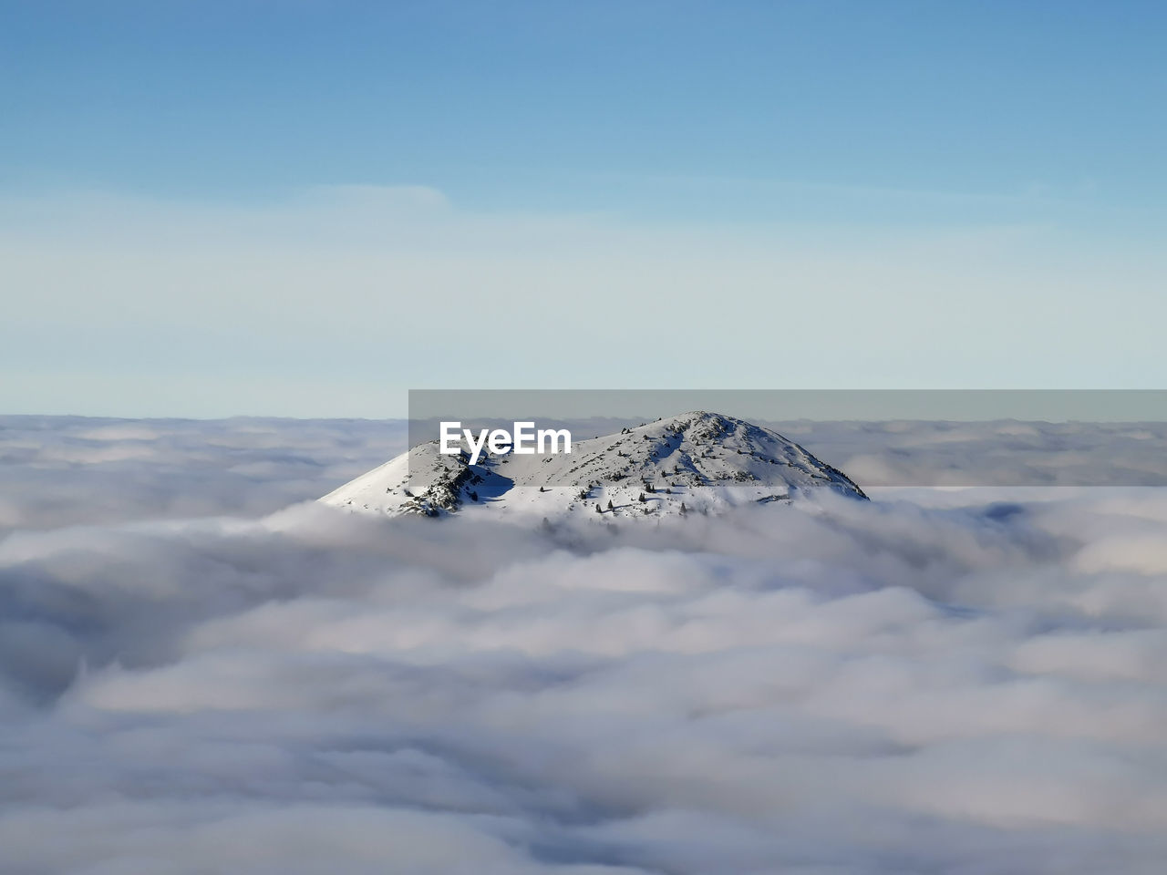 Scenic view of snowcapped mountain against sky