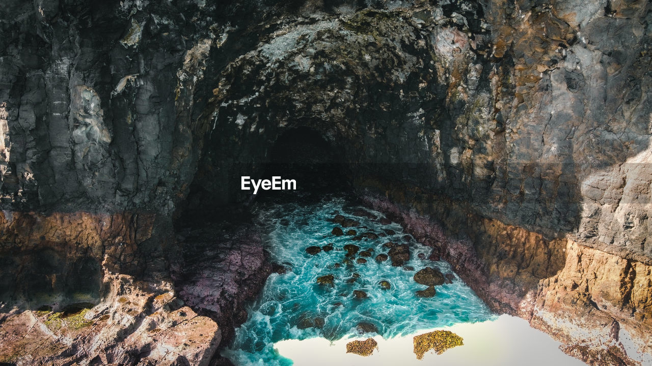 Panoramic view of sea and cave