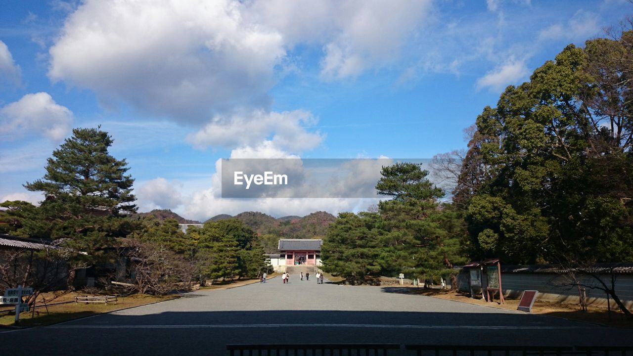 VIEW OF ROAD AGAINST CLOUDY SKY