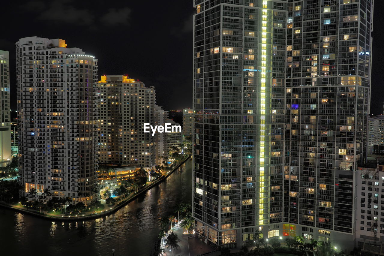 Aerial view of city lit up at night