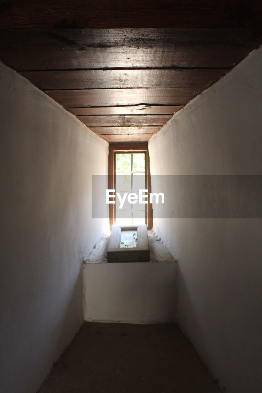 architecture, indoors, building, light, corridor, arcade, no people, house, built structure, wall - building feature, room, hall, wall, floor, entrance, window, sunlight, door, absence, home interior, wood, day, domestic room, abandoned, darkness, nature, empty