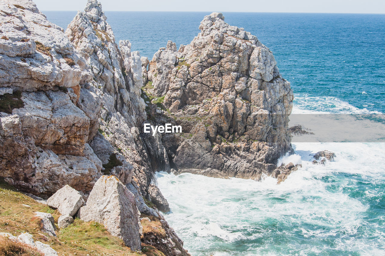 SCENIC VIEW OF ROCKS IN SEA