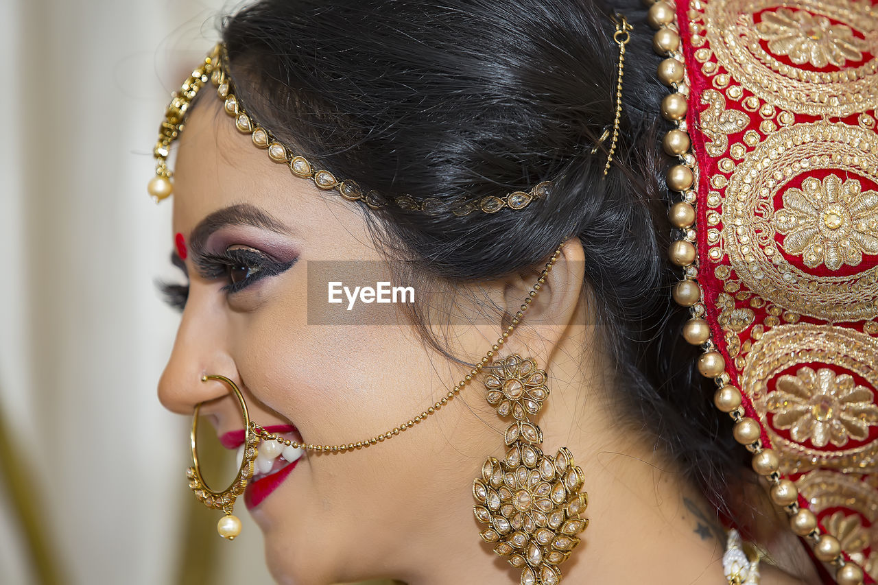 Close-up of smiling bride looking away