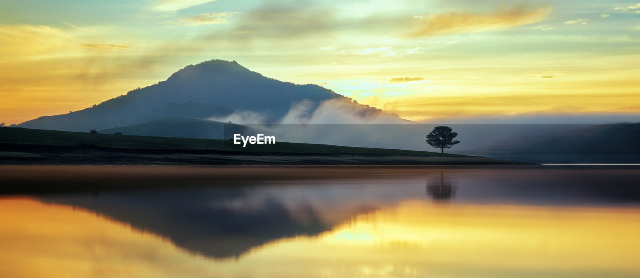 scenic view of snowcapped mountains against sky during sunset