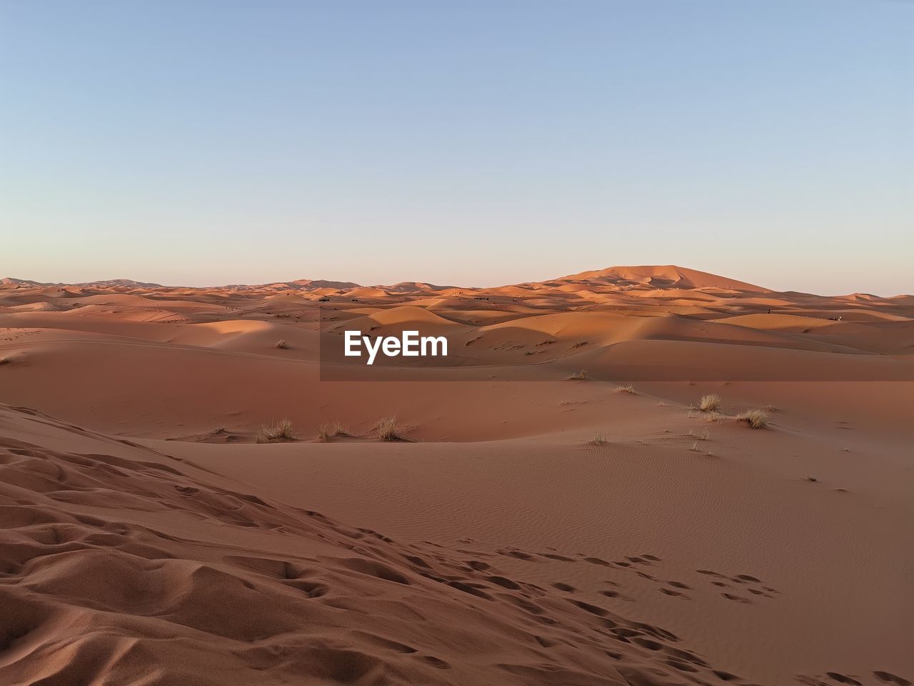 Scenic view of desert against clear sky