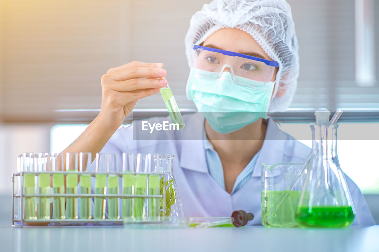 Female scientist experimenting in laboratory