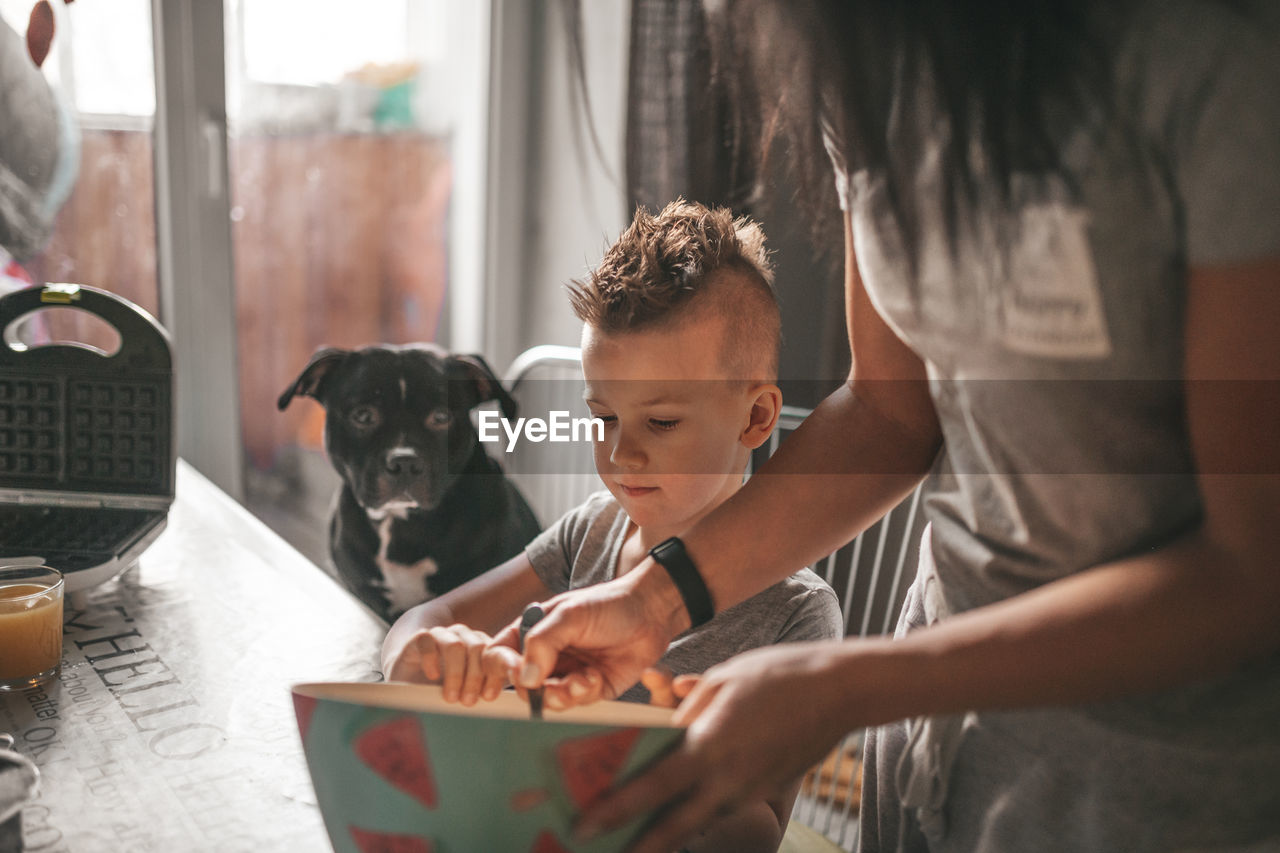 Boy and dog at home