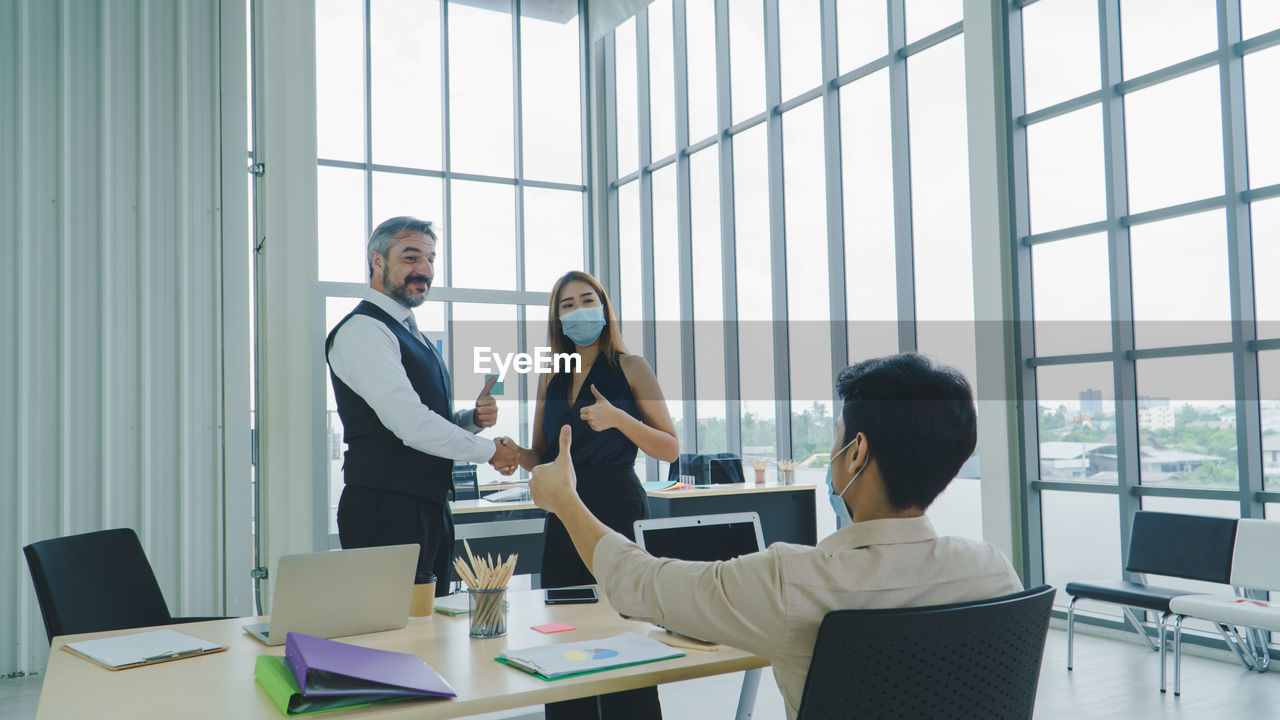 PEOPLE WORKING AT TABLE