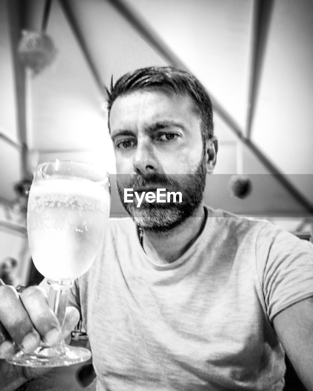 PORTRAIT OF MAN DRINKING GLASS IN A DRINK