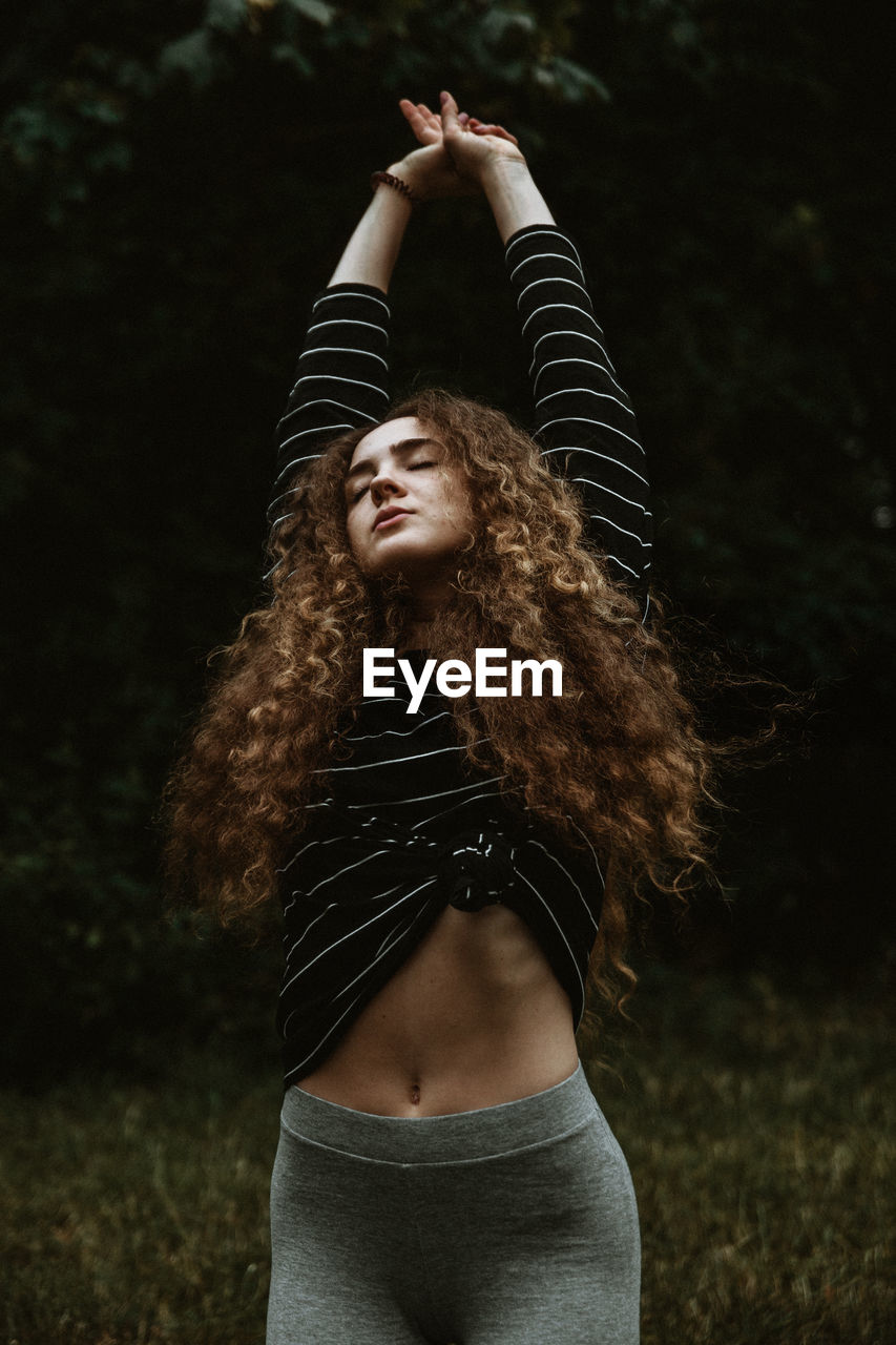 Young woman doing some stretching before sports