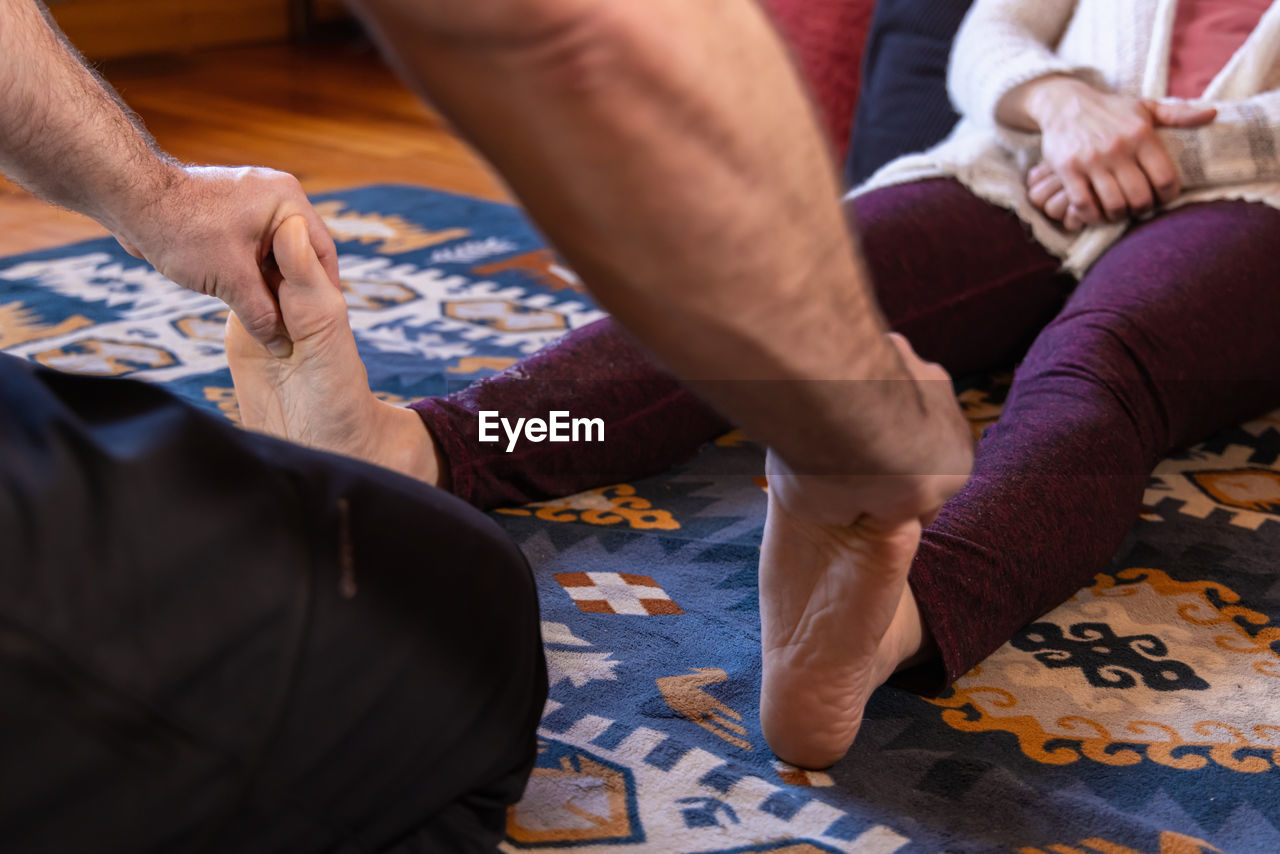 low section of business people stacking hands